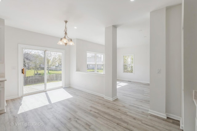2895 Lahinch Ct, Aurora, IL 60503 - unfurnished dining area featuring light wood-type flooring, a chandelier, and recessed lighting