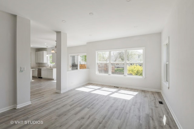 2895 Lahinch Ct, Aurora, IL 60503 - unfurnished living room with light wood finished floors and recessed lighting