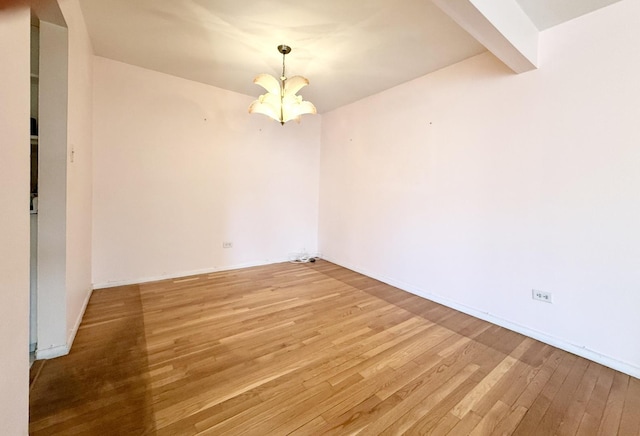 8928 Stevens Dr Unit 1A, Des Plaines, IL 60016 - unfurnished room with a chandelier and light wood-style flooring