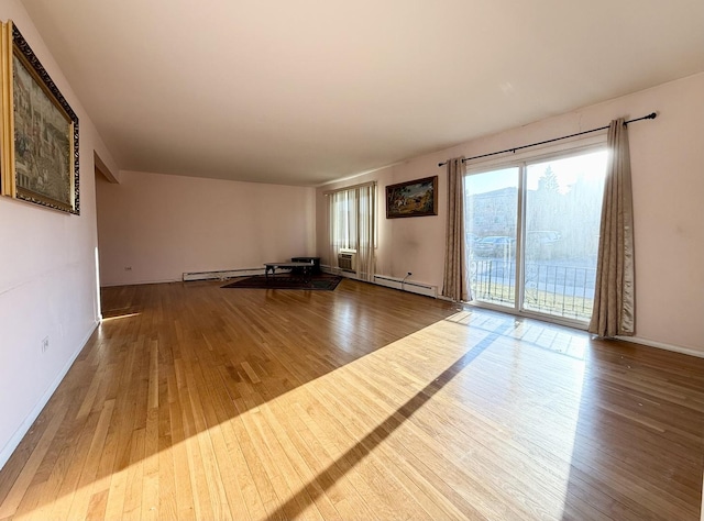 8928 Stevens Dr Unit 1A, Des Plaines, IL 60016 - unfurnished living room featuring wood finished floors, baseboard heating, and a baseboard radiator