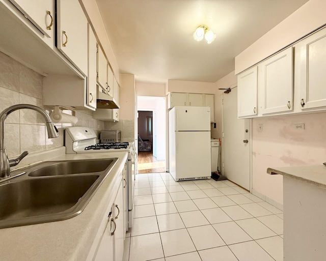 8928 Stevens Dr Unit 1A, Des Plaines, IL 60016 - kitchen with white appliances, under cabinet range hood, white cabinets, tasteful backsplash, and light countertops