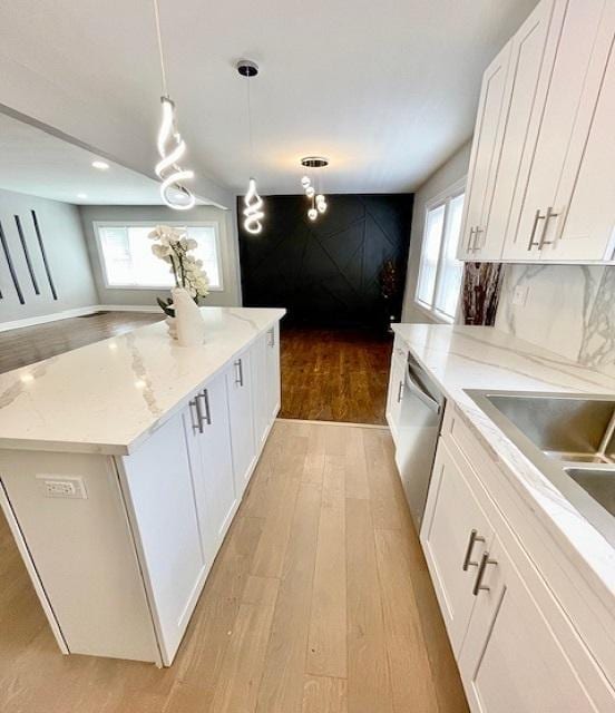 9302 S Eberhart Ave, Chicago, IL 60619 - kitchen with a center island, light wood-type flooring, plenty of natural light, white cabinetry, and recessed lighting