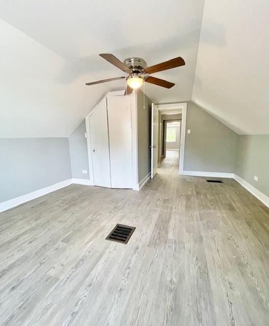 9302 S Eberhart Ave, Chicago, IL 60619 - bonus room with a ceiling fan, vaulted ceiling, and wood finished floors