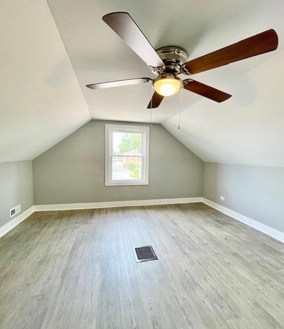 9302 S Eberhart Ave, Chicago, IL 60619 - bonus room featuring a ceiling fan, wood finished floors, and lofted ceiling