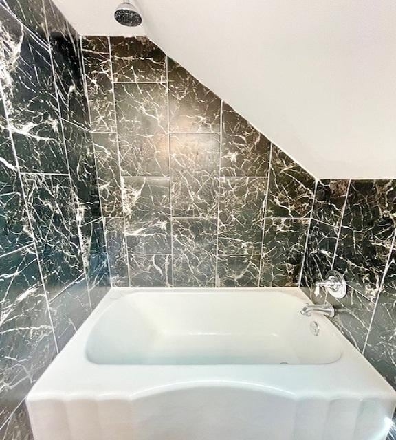 9302 S Eberhart Ave, Chicago, IL 60619 - full bathroom featuring tile walls, a bathtub, a shower, and lofted ceiling