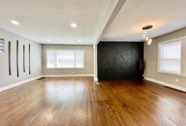 9302 S Eberhart Ave, Chicago, IL 60619 - empty room with wood finished floors and recessed lighting