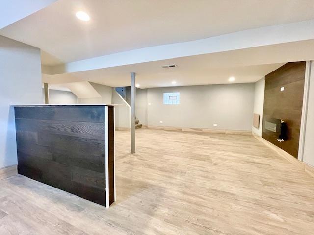 9302 S Eberhart Ave, Chicago, IL 60619 - finished basement featuring wood finished floors and recessed lighting