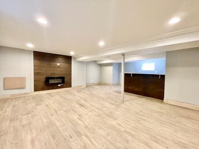 9302 S Eberhart Ave, Chicago, IL 60619 - basement featuring a fireplace, wood finished floors, and recessed lighting