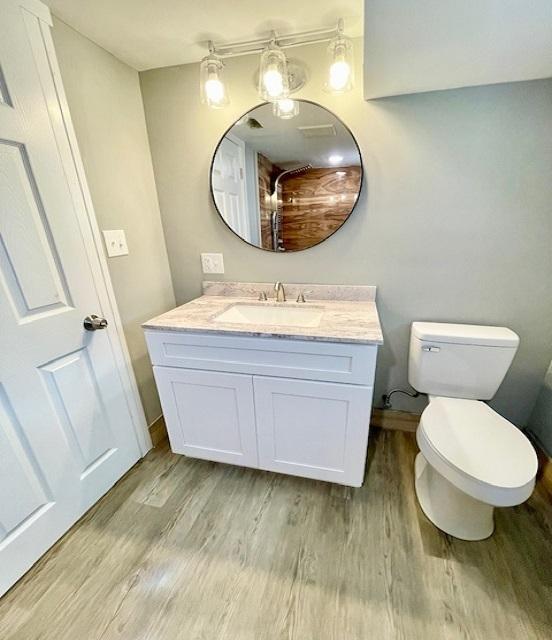 9302 S Eberhart Ave, Chicago, IL 60619 - bathroom featuring vanity and wood finished floors