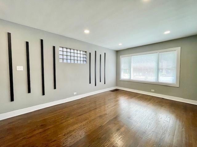 9302 S Eberhart Ave, Chicago, IL 60619 - empty room featuring dark wood-type flooring and recessed lighting
