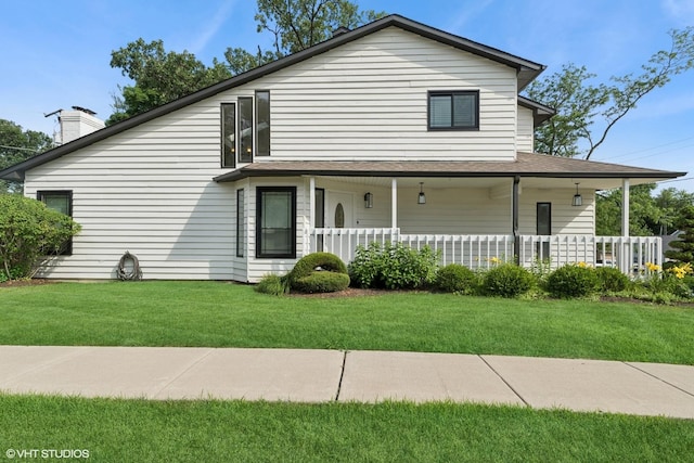 1315 Ardmore Dr, Round Lake Beach, IL 60073 - view of front of property with covered porch, a front lawn, and a chimney