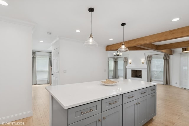 1315 Ardmore Dr, Round Lake Beach, IL 60073 - kitchen featuring gray cabinets, recessed lighting, light countertops, healthy amount of natural light, and beam ceiling