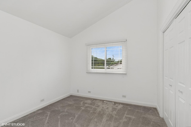 1315 Ardmore Dr, Round Lake Beach, IL 60073 - unfurnished bedroom with lofted ceiling, carpet flooring, and a closet