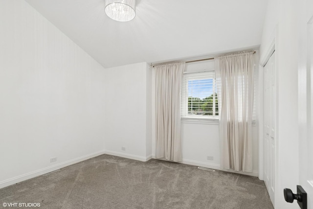 1315 Ardmore Dr, Round Lake Beach, IL 60073 - unfurnished room featuring carpet flooring and a chandelier