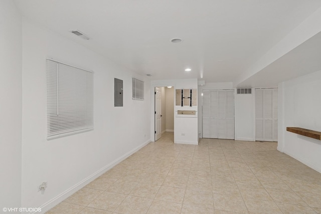 1315 Ardmore Dr, Round Lake Beach, IL 60073 - spare room with electric panel, recessed lighting, and light tile patterned flooring