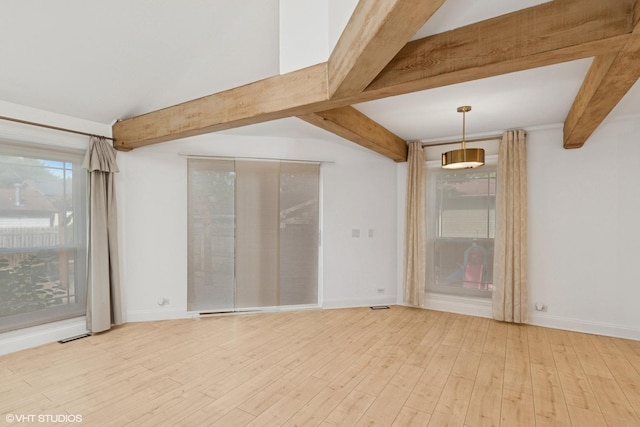1315 Ardmore Dr, Round Lake Beach, IL 60073 - spare room featuring beam ceiling and light wood-type flooring