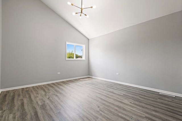 15355 7th Ave, Phoenix, IL 60426 - unfurnished room with a chandelier, wood finished floors, and high vaulted ceiling