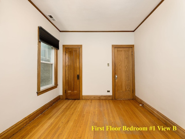 6527 N Onarga Ave, Chicago, IL 60631 - empty room featuring crown molding and light wood finished floors