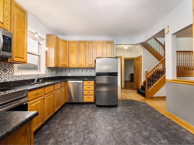 6527 N Onarga Ave, Chicago, IL 60631 - kitchen featuring stainless steel appliances, tasteful backsplash, dark countertops, dark wood-style floors, and brown cabinetry