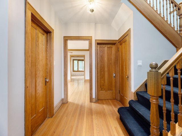 6527 N Onarga Ave, Chicago, IL 60631 - hall with light wood-style flooring, stairs, and a baseboard heating unit