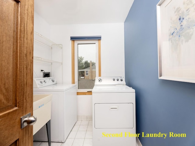 6527 N Onarga Ave, Chicago, IL 60631 - laundry room with washer and clothes dryer and light tile patterned flooring