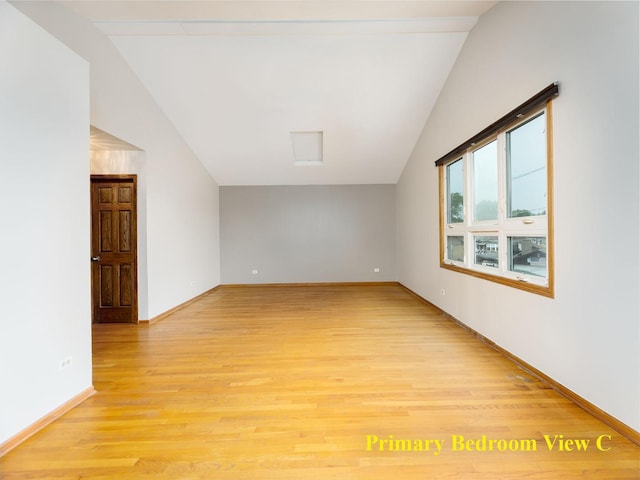 6527 N Onarga Ave, Chicago, IL 60631 - spare room with vaulted ceiling and light wood finished floors