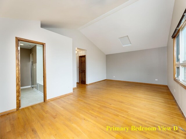 6527 N Onarga Ave, Chicago, IL 60631 - spare room featuring light wood-type flooring and vaulted ceiling