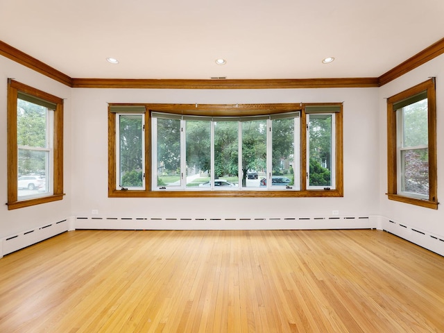 6527 N Onarga Ave, Chicago, IL 60631 - spare room featuring crown molding, light wood-type flooring, recessed lighting, and a baseboard heating unit