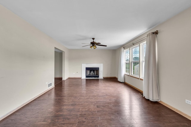 3505 Indian Head Ln, Joliet, IL 60435 - unfurnished living room with ceiling fan, dark wood-type flooring, and a fireplace