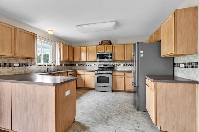 3505 Indian Head Ln, Joliet, IL 60435 - kitchen with stainless steel appliances, a peninsula, tasteful backsplash, and dark countertops