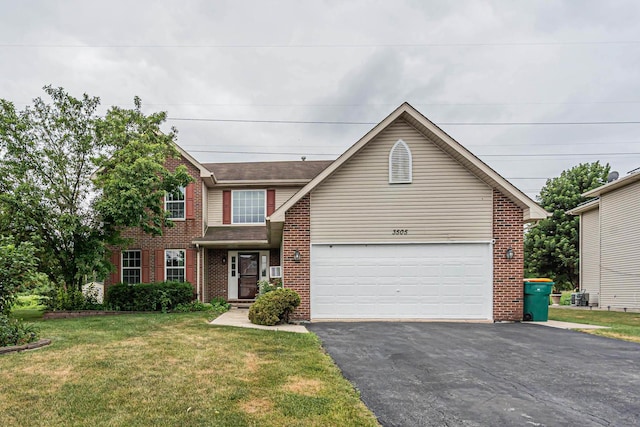 3505 Indian Head Ln, Joliet, IL 60435 - view of front of home with brick siding, asphalt driveway, a front yard, and a garage