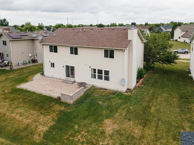 3505 Indian Head Ln, Joliet, IL 60435 - rear view of property with a patio area, a chimney, a lawn, and a residential view