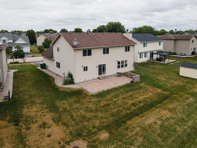 3505 Indian Head Ln, Joliet, IL 60435 - rear view of property with a gazebo, a patio area, a residential view, a lawn, and roof with shingles