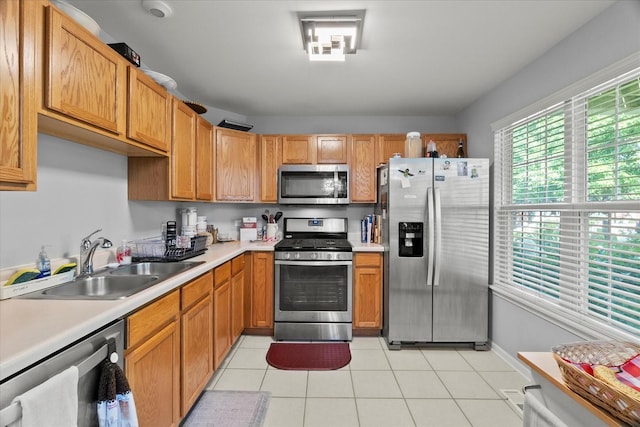 2204 Waterleaf Ct Unit 103, Naperville, IL 60564 - kitchen featuring appliances with stainless steel finishes, light countertops, and light tile patterned floors