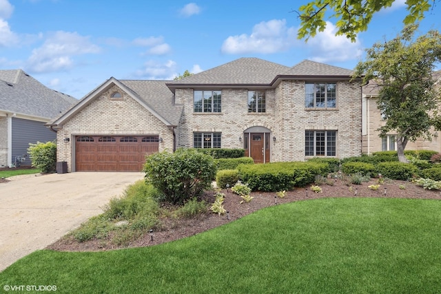 10809 Chaucer Dr, Willow Springs, IL 60480 - french country style house featuring driveway, a front lawn, brick siding, an attached garage, and roof with shingles