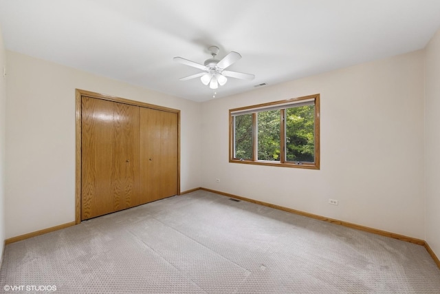 10809 Chaucer Dr, Willow Springs, IL 60480 - unfurnished bedroom with light colored carpet, a closet, and a ceiling fan