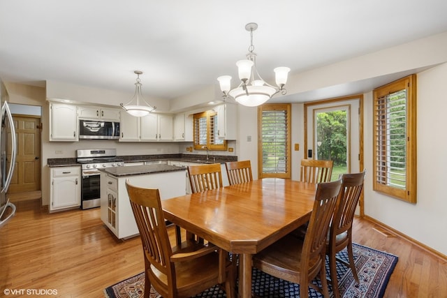10809 Chaucer Dr, Willow Springs, IL 60480 - dining room featuring a chandelier and light wood-type flooring