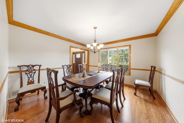 10809 Chaucer Dr, Willow Springs, IL 60480 - dining area with a chandelier, light wood-type flooring, and crown molding