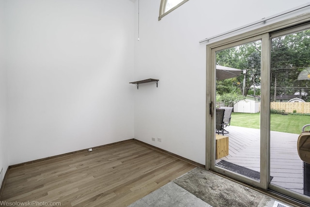 20739 N Weiland Rd, Prairie View, IL 60069 - doorway to outside featuring wood finished floors and baseboards