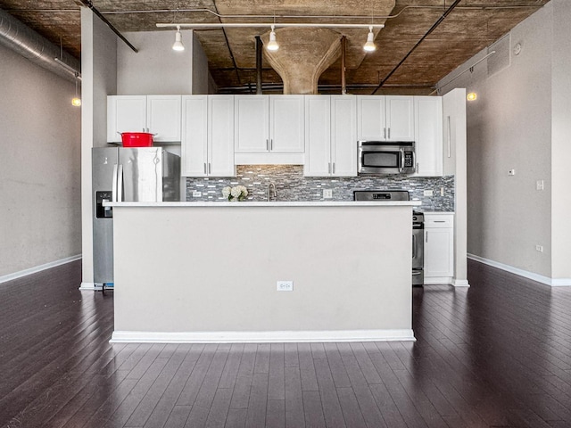 1550 S Blue Island Ave Unit 1125, Chicago, IL 60608 - kitchen with stainless steel appliances, rail lighting, dark wood-style flooring, backsplash, and a high ceiling