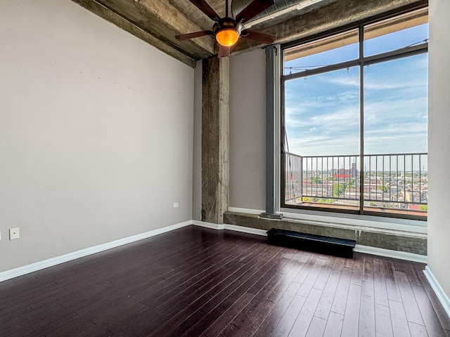 1550 S Blue Island Ave Unit 1125, Chicago, IL 60608 - unfurnished room featuring dark wood-style flooring, plenty of natural light, and ceiling fan