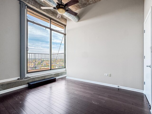 1550 S Blue Island Ave Unit 1125, Chicago, IL 60608 - spare room with dark wood-type flooring, healthy amount of natural light, and a ceiling fan