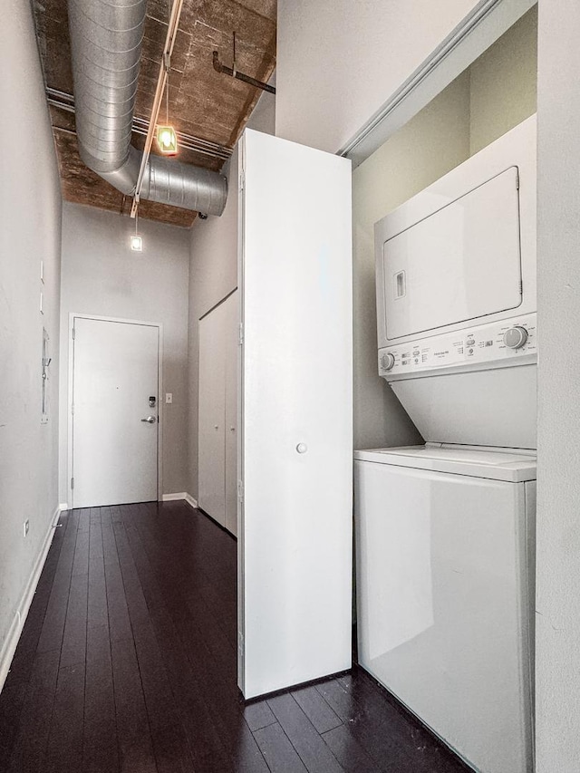 1550 S Blue Island Ave Unit 1125, Chicago, IL 60608 - laundry area with stacked washer / drying machine and dark wood-style floors