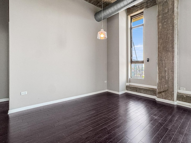 1550 S Blue Island Ave Unit 1125, Chicago, IL 60608 - empty room with dark wood finished floors and baseboards