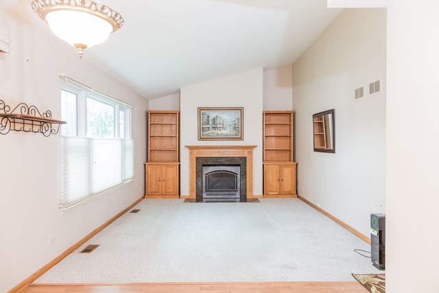 216 Dickens Trl, Elgin, IL 60120 - unfurnished living room featuring vaulted ceiling and a fireplace
