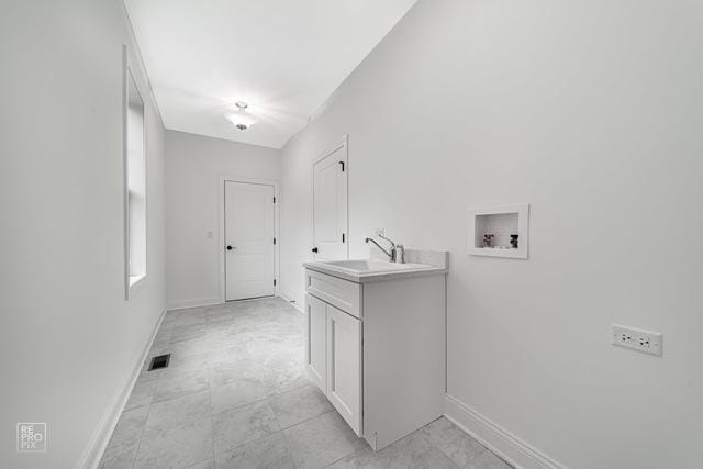 1122 W Wilson St, Palatine, IL 60067 - washroom featuring washer hookup and baseboards
