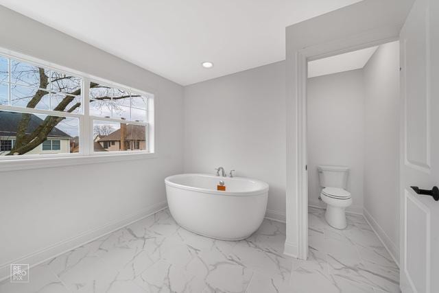 1122 W Wilson St, Palatine, IL 60067 - full bathroom featuring a freestanding tub and marble finish flooring