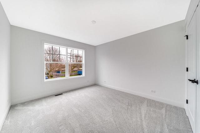 1122 W Wilson St, Palatine, IL 60067 - empty room featuring carpet