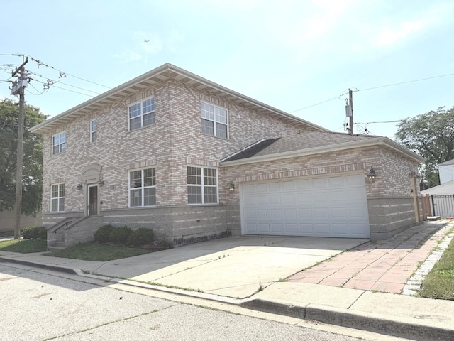 1136 Park Pl, Bellwood, IL 60104 - view of front of house featuring brick siding, a garage, and driveway