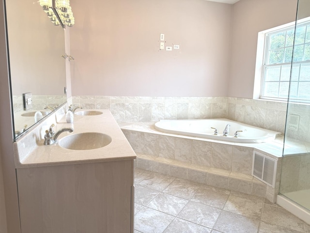 1136 Park Pl, Bellwood, IL 60104 - full bathroom with a bath and double vanity